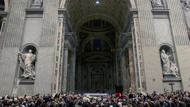 The corpse of Saint Pio da Pietralcina, also known as "Padre Pio", is carried inside St Peter's Basilica on Friday.