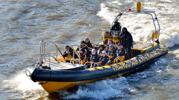 Tourists speed along the Thames with music blasting.