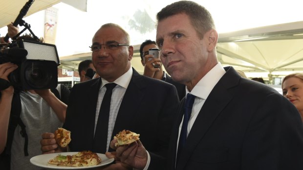 Former premier Mike Baird on the 2015 campaign trail in Auburn with the party's candidate Ronney Oueik, a former Auburn councillor.