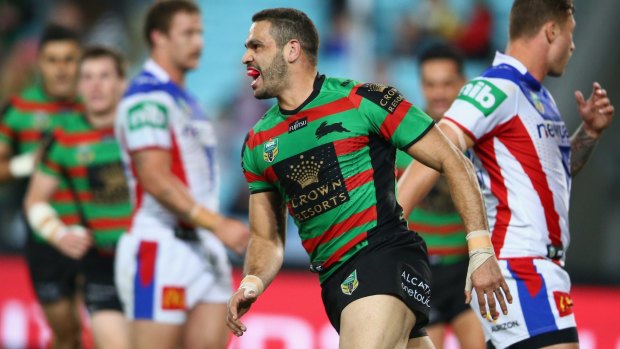 Good night: Greg Inglis of the Rabbitohs celebrates scoring a try against the Knights. 
