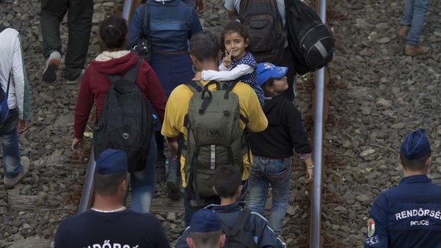 A smile of hope from a Syrian girl on the move in Hungary.