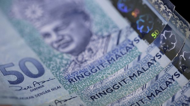 Malaysia's currency, the ringgit, has plunged as the ongoing political scandal, China's yuan devaluation and slumping oil prices take their toll.