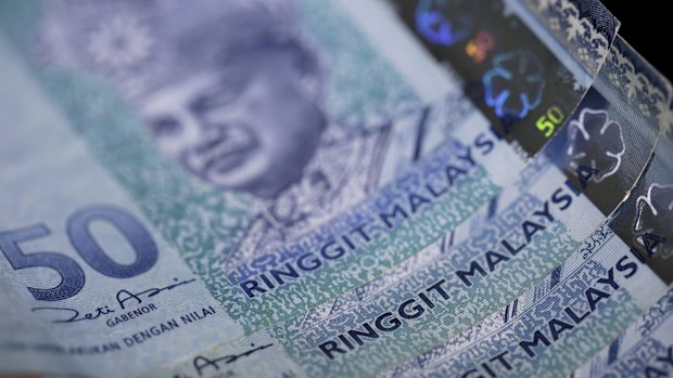 Malaysia's currency, the ringgit, has plunged as the ongoing political scandal, China's yuan devaluation and slumping oil prices take their toll.