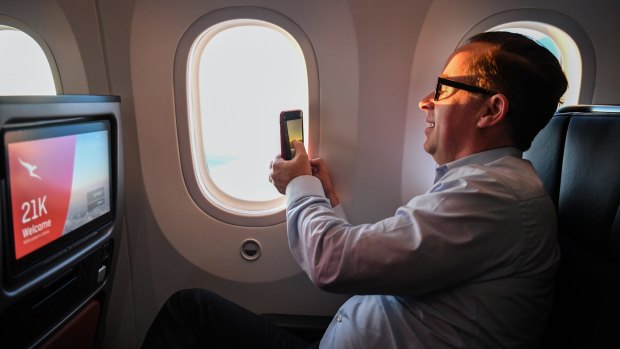 Alan Joyce takes a photo of the sunrise on the Project Sunrise test flight from London to Sydney.