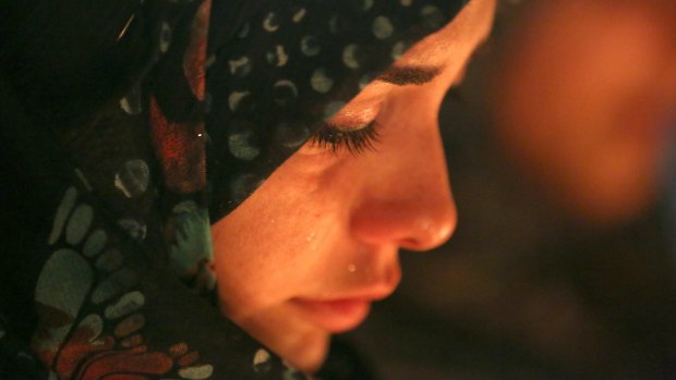 A woman grieves during the funeral procession of a bomb victim in Baghdad.