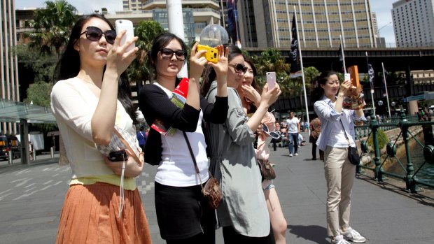 Chinese tourists in Sydney. Chinese tourists now spend $300 billion overseas each year.