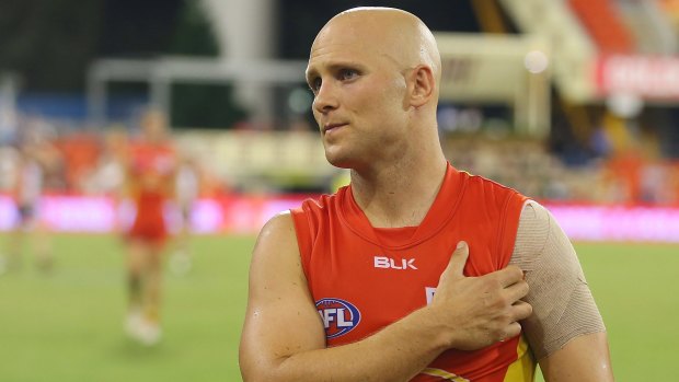 Gary Ablett feels for his shoulder after the Suns lost to the Saints in round two.