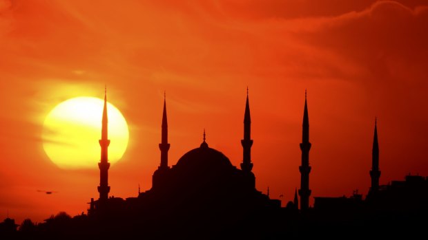 The silhouette of the Blue Mosque of Istanbul at sunset.