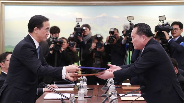 South Korean Unification Minister and chief delegate Cho Myoung-gyon and his North Korean counterpart Ri Son-gwon at the close of the first inter-Korean talks on Tuesday.