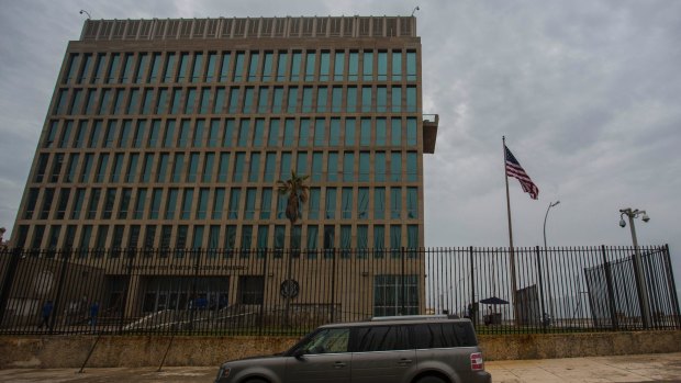 A car is parked outside the compound of the United States embassy in Havana, Cuba.