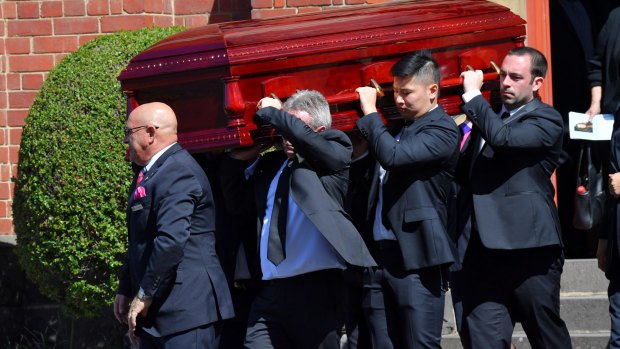 Karen Ristevski's coffin is carried to the hearse after Monday's funeral service.