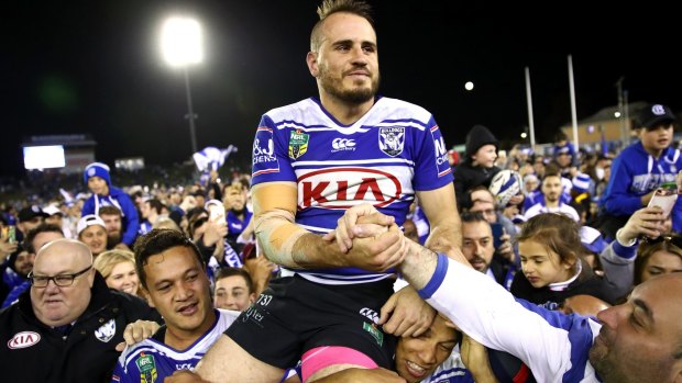 Top Dog: Incredible scenes as the Bulldogs' faithful enter the field of play to see off Josh Reynolds in his final game at the club's spiritual home.