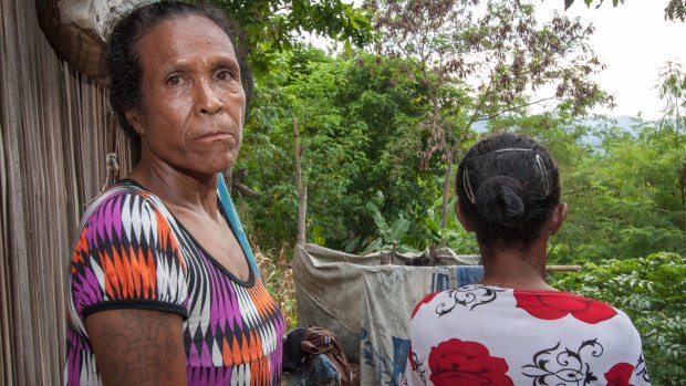 Filomena Gomes and her sister at their home in the slums encircling Dili.