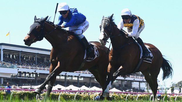 Big finish: Kerrin McEvoy rides Oceanographer to victory in the Lexus Stakes at Flemington on Saturday.