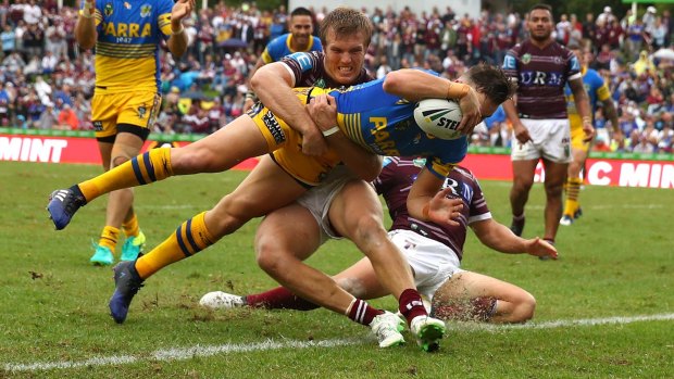 Determined: Clint Gutherson scores for the Eels.