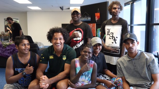 Popular: Felise Kaufusi meets some of the local kids at Darwin's Malak Clinic and Re-engagement Centre.