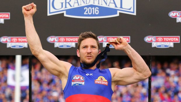 Matthew Boyd of the Bulldogs celebrates the win on the podium after the 2016 AFL grand final between the Sydney Swans and the Western Bulldogs 
