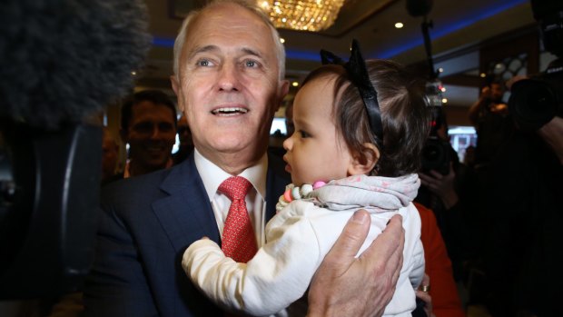 Mr Turnbull hugs his granddaughter Isla as he and Lucy Turnbull arrive at the Sunny Harbour Yum Cha restaurant in Hurstville, Sydney on Wednesday.