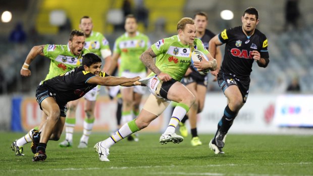 Canberra Raiders player Blake Austin gets away from Penrith Panthers player, Tyrone Peachey.