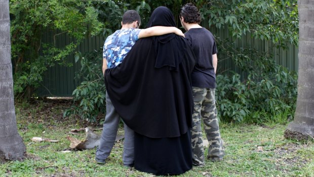 The 16-year-old boy, pictured on the right in 2014, spoke to Fairfax Media after his family home was raided. 