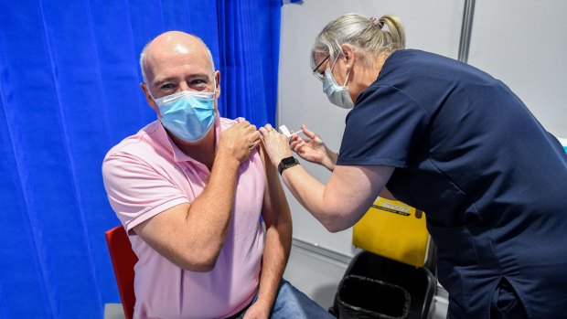Getting the COVID-19 vaccine at Melbourne's Exhibition Centre. One reader believes vaccinated Australians should not be given special privileges until everyone is eligible to get the vaccine.
