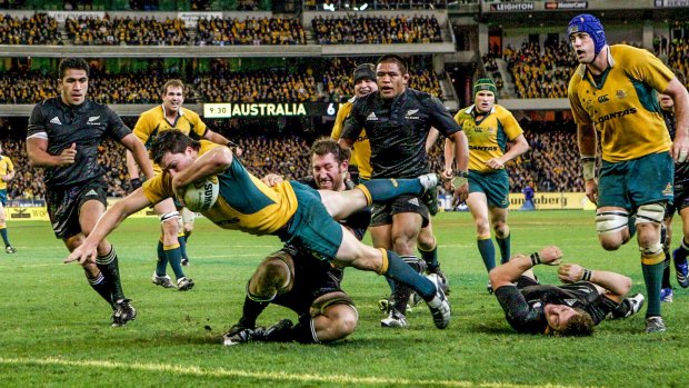 Try time: Adam Ashley-Cooper dives over the line in the corner to score a try during the Bledisloe Cup match in 2007.