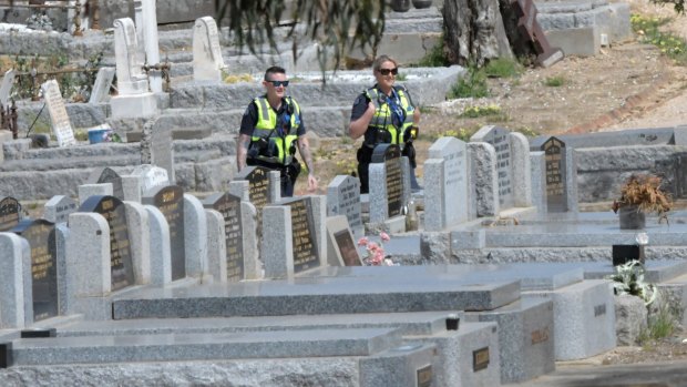 Police at Bendigo cemetery on Saturday.