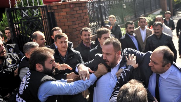 Istanbul police carried out a dawn raid, using tear gas to enter the headquarters of a media company linked to a government critic, enforcing a court order to seize the business. 