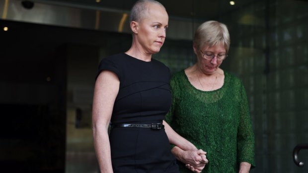 Ashley Bryant's wife Deborah (left) leaves the NSW Coroner's Court in Glebe on Wednesday.
