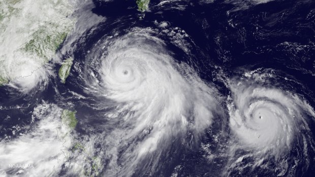 This satellite image taken by the JMA MTSAT-2 satellite on Thursday shows Tropical Storm Linfa, left, tracking westward parallel to the coast of China, and Typhoon Chan-Hom, over the Ryukyu Trench south of Okinawa, Japan, on a track heading north-west towards the China coast north of Wenzhou.