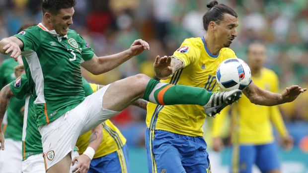 Sweden's Zlatan Ibrahimovic, right, is challenged by Ireland's Ciaran Clark.