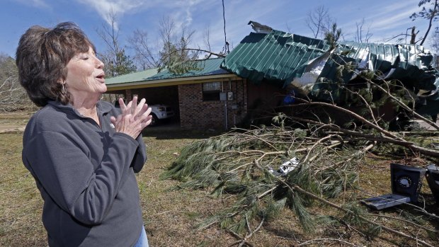Peggy Taylor speaks about how she prayed as she, a friend and her 10-month-old grandson, huddled in a tub while what she believes was a tornado hit Stronghope, Mississippi on Tuesday.