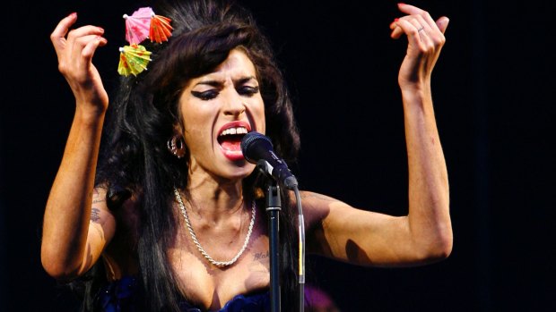 The blue dress Winehouse wore to Glastonbury in 2008 is part of the exhibition.