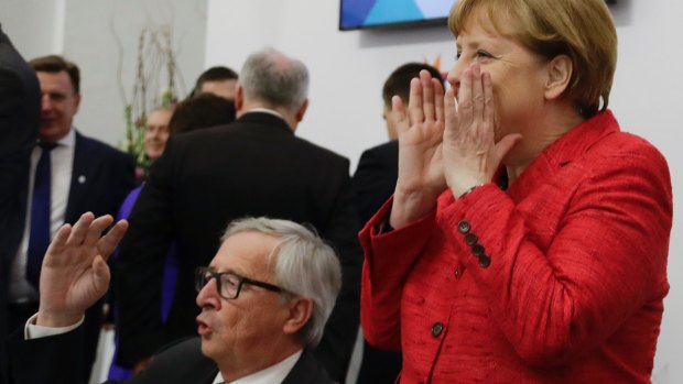 European Commission President Jean-Claude Juncker, left, and German Chancellor Angela Merkel attend an EU summit on refugees, in Valletta, Malta last week.