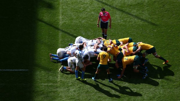 Scrummaging: Halfback Nick Phipps prepares to put the ball into the scrum against Uruguay.