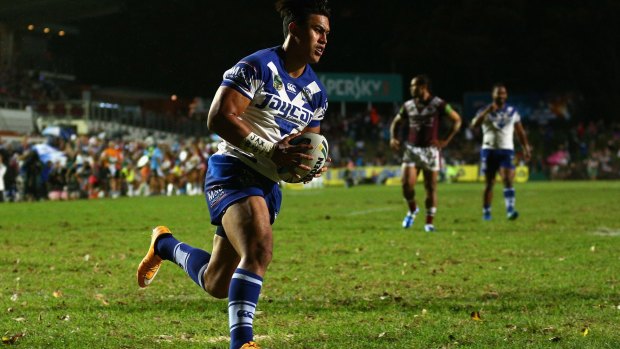 Timoteo Lafai scores a try against the Sea Eagles on Friday night.
