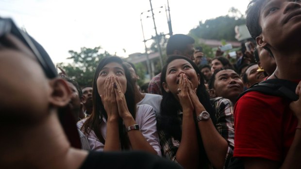 NLD supporters watch television coverage of the election outside the party headquarters in Yangon, Myanmar, on Sunday.