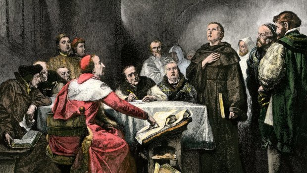 Martin Luther is depicted in a monk's habit standing before his accusers at the Diet of Worms in 1521.
