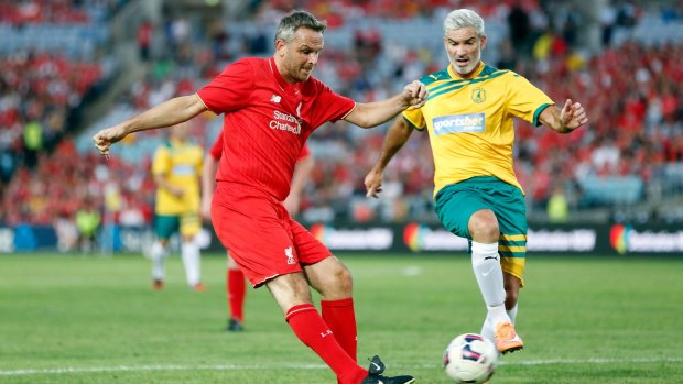 Craig Foster battles for possession with former Liverpool midfielder Didi Hamann on Thursday night. 