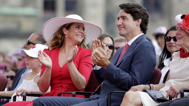 The Trudeaus applaud during Canada Day performances on Friday.