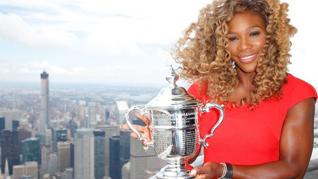 Reigning champion: Serena Williams poses with the trophy on top of the Empire State Building last year.