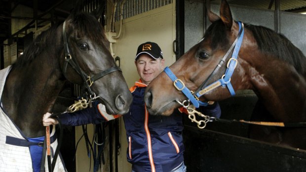 Trainer Kris Lees with gallopers Lucia Vallentina (left)  and Protectionist.