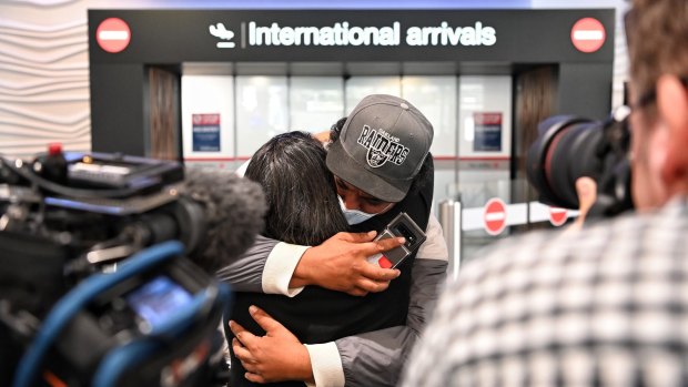Emotional arrivals at Auckland airport after the first trans-Tasman bubble flight. Most of the people looking to leave Australia right now aren't aiming to have a holiday.