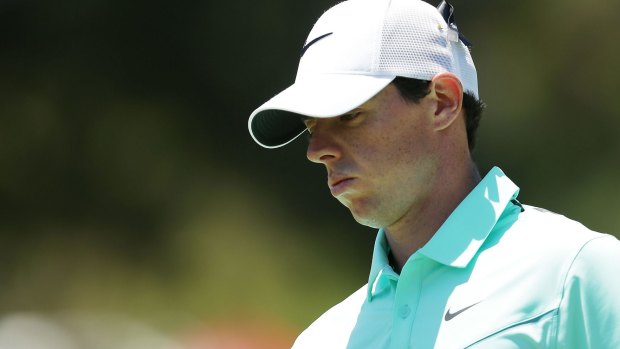 Bogey man: A pensive Rory McIlroy during his disastrous third round in the Australian Open at The Australian on Saturday.