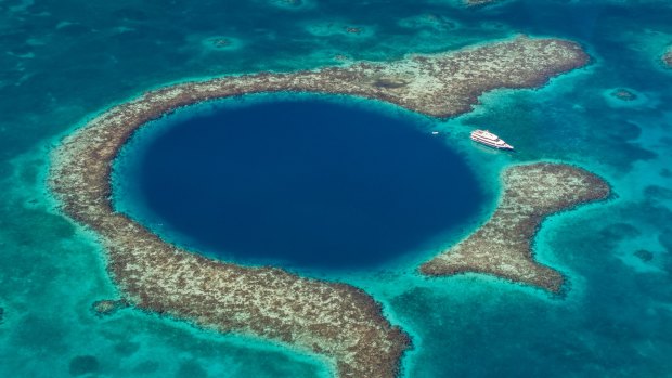 The Great Blue Hole off the coast of Belize. it's large enough to fit two Boeing 747 jumbo jets inside.