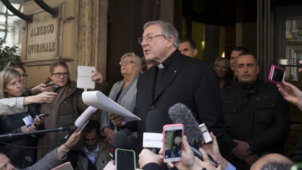 Cardinal George Pell reads a statement after a meeting at Rome's Quirinale hotel with the victims of child sex abuse on Thursday.