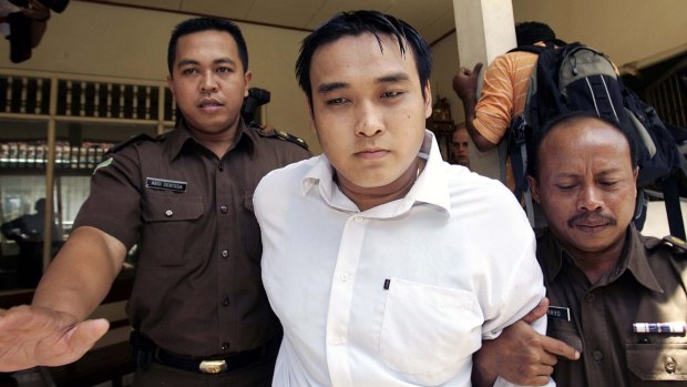 Australian Tan Duc Thanh Nguyen is led into a Denpasar courtroom during his trial for drug smuggling.