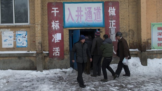Miners arrive for shifts at a mine affiliated with Longmay Group, in Hegang, China.