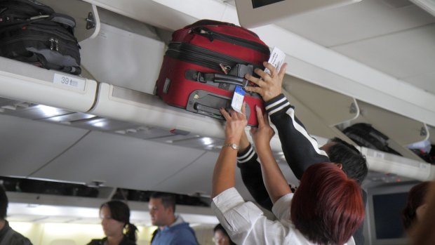 An overeager passenger dropped their cabin bag on the head of a Traveller reader.