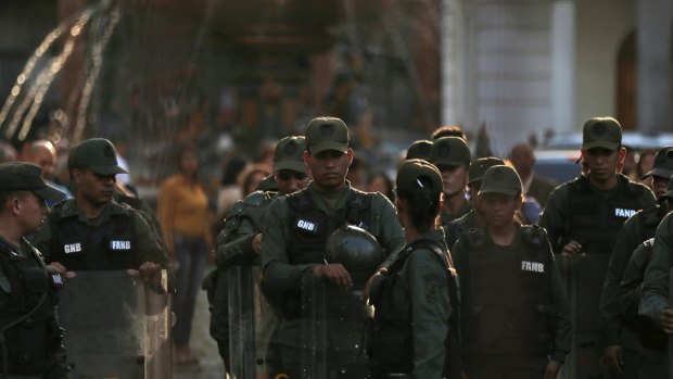 Venezuelan Bolivarian National Guard line up inside of National Assembly building in Caracas, Venezuela, on Tuesday.